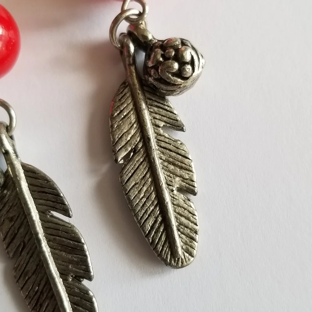 Feather earrings with red beads and flower ball beads silver tone boho